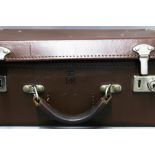 Queen Elizabeth II monogrammed brown leather suitcase, stamped with ERII & Crown, 40 x 30cm,