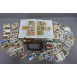 Quantity of cigarette cards, Cigarette Pack Art hardback reference book and a vintage copper and