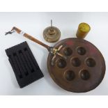 Copper pan with eight circular wells, 51cm long, two horn beakers, small carved oak folding stand,