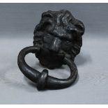 Lion door knocker in black painted iron. 20cm