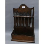 Antique oak spoon rack containing six pewter spoons and a knife, 48 x 31cm