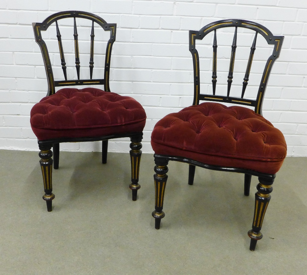 Pair of Victorian ebonised and parcel gilt side chairs with button upholstered stuff over seats.