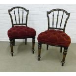 Pair of Victorian ebonised and parcel gilt side chairs with button upholstered stuff over seats.
