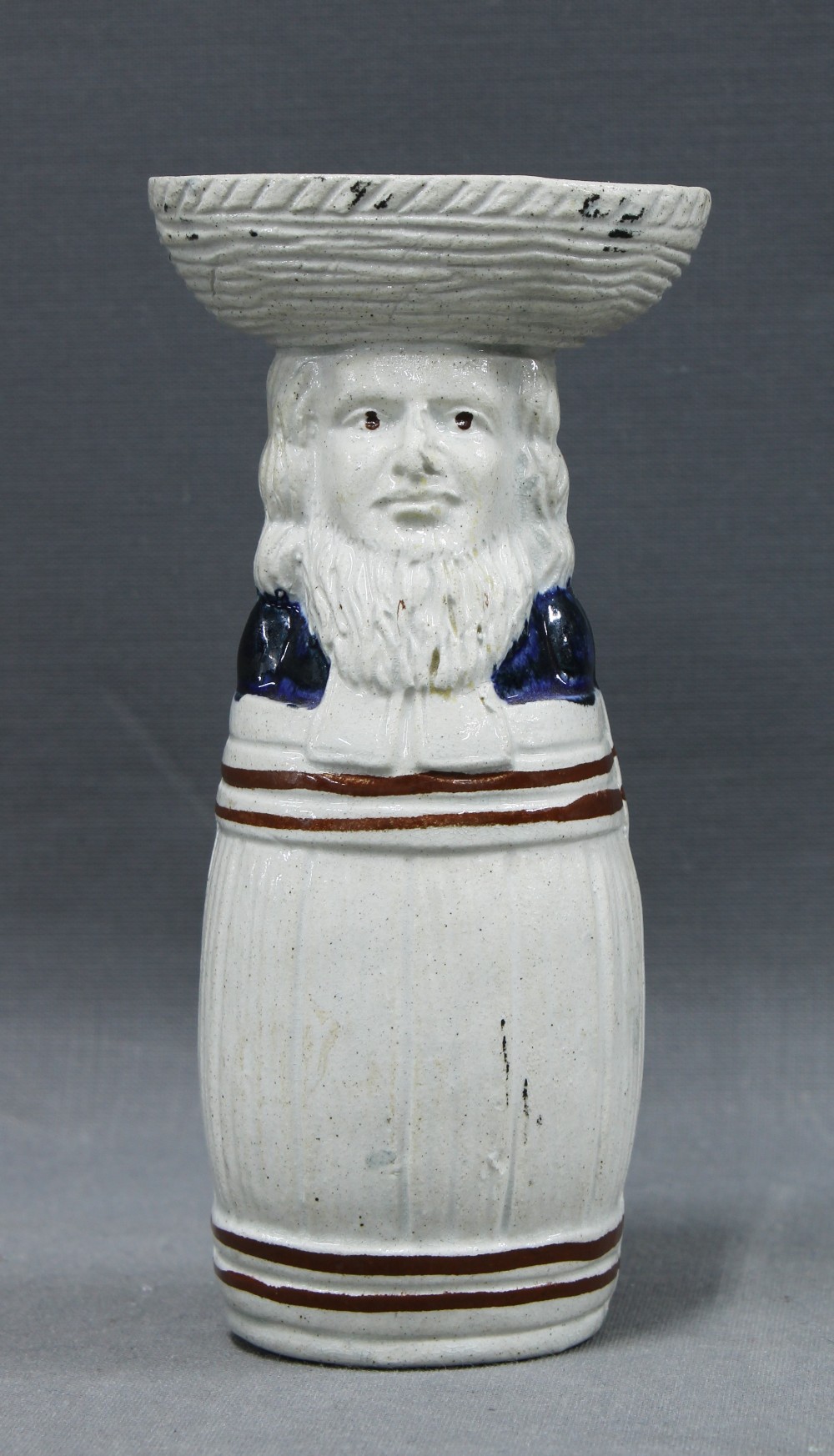 Rare saltglazed pottery Judge and barrel salt condiment in blue and white with copper lustre