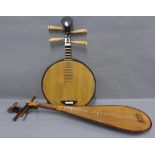 Two stringed instruments of unusual form, longer 100cm (2)