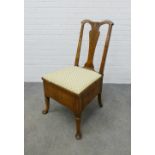 Walnut veneered commode chair with Queen Anne splat back, feather edge banding and upholstered seat,