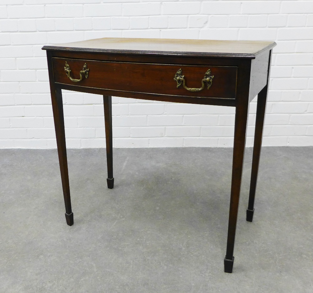 Mahogany bow front side table with single frieze drawer, raised on tapering legs with spade feet. 77