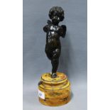 Bronze figure of a putto on a circular Sienna marble base, 27cm