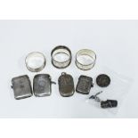 Four silver vesta case, three silver napkin rings, two silver thimbles and a silver brooch (damaged)