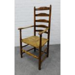Lancashire ladderback open armchair, with woven rush seat 114 x 59 x 40cm.