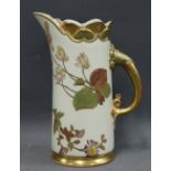 Royal Worcester blush ivory ewer with a shell moulded rim and hand painted with floral pattern,