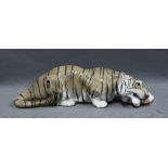 Royal Copenhagen porcelain tiger, in recumbent pose and feeding, Model No 2065, printed factory