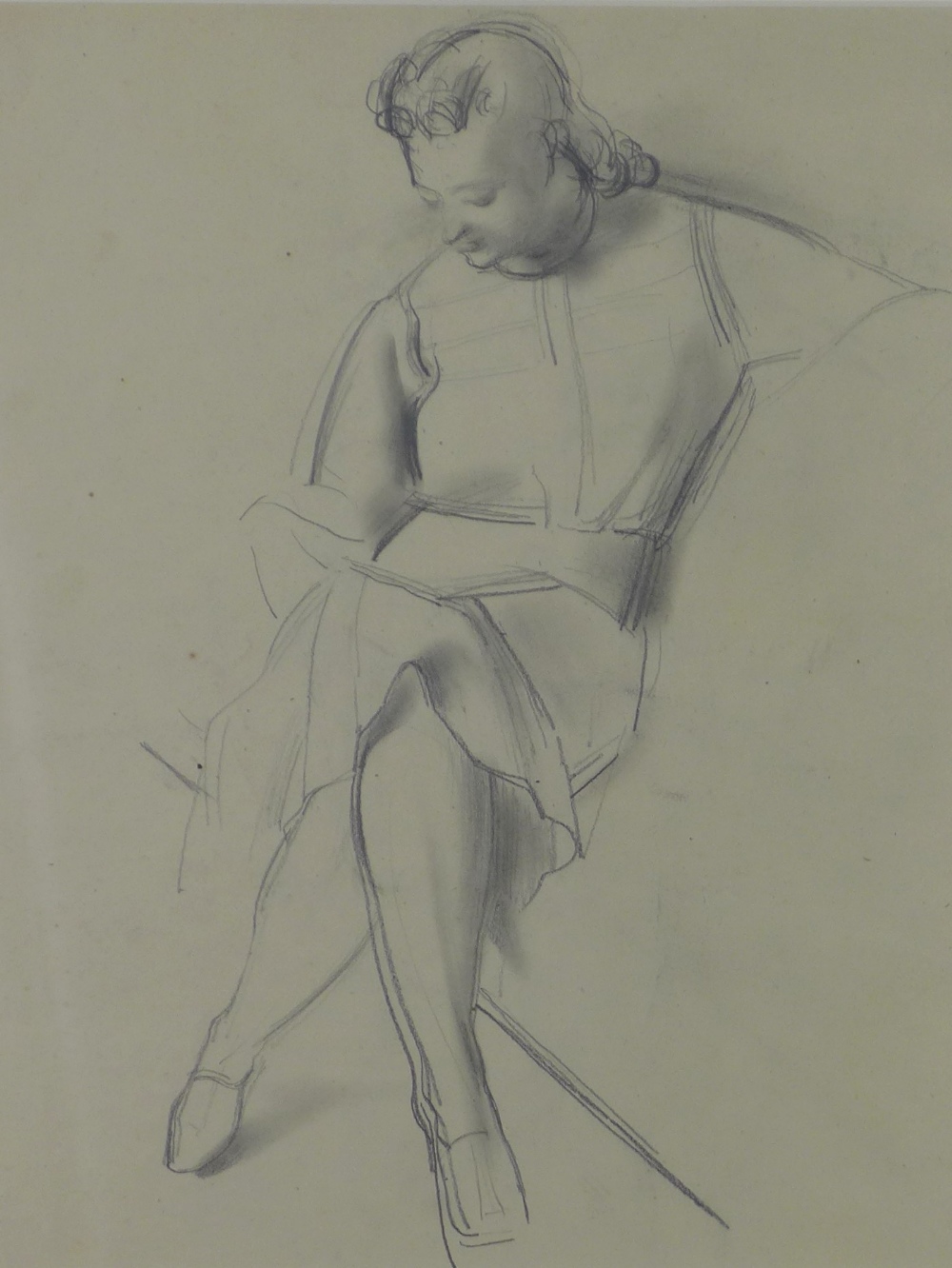 Pencil sketch of a young woman seated, apparently unsigned, framed under glass, 32 x 42cm