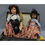 Two vintage dolls and a brown leather case (3)