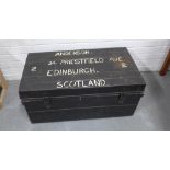 Vintage black painted metal trunk, labelled Anderson, Edinburgh, Scotland, with red interior. 37 x