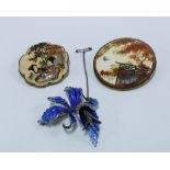 Two Japanese Satsuma brooches, and a silver and enamel flowerhead brooch (3)