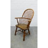 Child's elm and ash Windsor chair with hoop back, solid seat and turned legs & stretcher, with loose