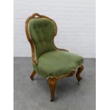 Victorian walnut chair with upholstered back and seat on cabriole legs terminating on ceramic