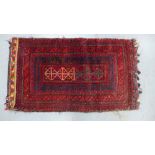Belouch mat / small rug,with a flatweave backing with sign of old moth damage, 105 x 59cm