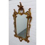 Rococo style gilt framed wall mirror. 109 x 59cm.