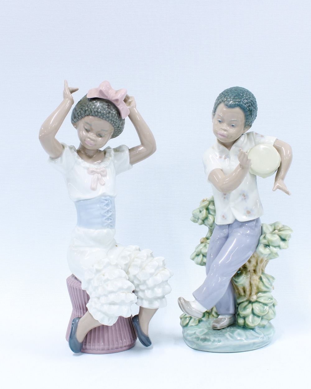 Two Lladro figures to include Rhumba 1560 & Bongo Drum (2) 23cm.