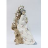 Lladro porcelain figure of a Geisha beneath a prunus tree, 30cm.