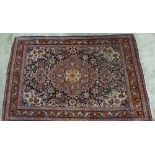 Persian rug with all-over foliate pattern, ivory spandrels and blue borders, 166 x 110cm