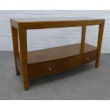 Contemporary cherrywood consol table with glass top and two base drawers, 77 x 121 x 45cm.
