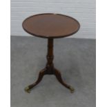 Mahogany pedestal table, the circular dished top on a baluster turned column and tripod legs with