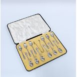 Cased set of twelve Walker & Hall silver teaspoons and matching sugar tongs, Sheffield 1936