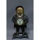 Figural spelter clock with moving eyes, 38cm