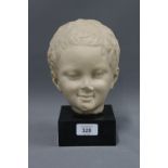 Child's head sculpture, a B.M Replica on ebonised plinth, 22cm