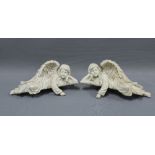 Pair of resin angels, each in recumbent pose with an overhanging arm, 28cm (2)