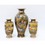 A pair of Japanese Satsuma '1,000 faces' pattern vases and another of larger size, all signed (3)