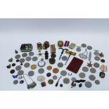 A quantity of miscellaneous WWII medals, coins, commemorative coins, vesta case, corkscrews and
