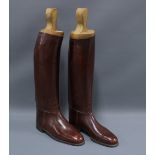 Pair of brown leather riding boots by Berson, No. 13, with wooden boot trees