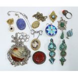 A collection of costume jewellery to include coloured hardstone pendants, git metal bracelet etc