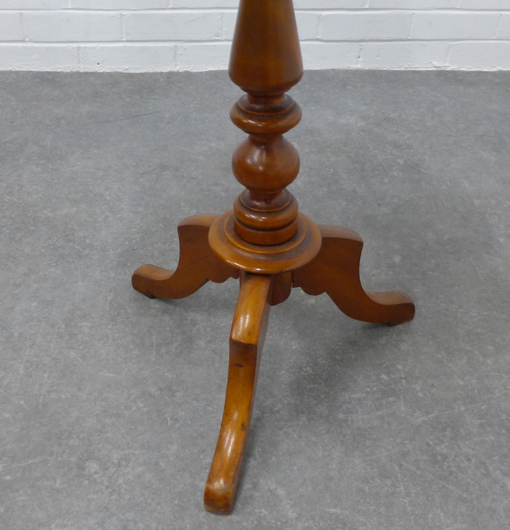 Mahogany pedestal table with an oval top and outswept tripod legs, 72 x 55 x 43cm. - Image 3 of 3