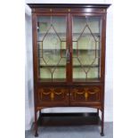 Edwardian rosewood and marquetry display cabinet with a stepped cornice over a pair of astragal