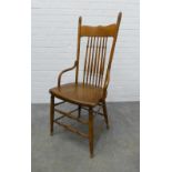 An Arts & Crafts oak spindle back chair in the manner of William Birch, . 109 x 50 x 42cm.