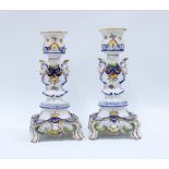 A pair of faience pottery candlesticks (2) 25cm.