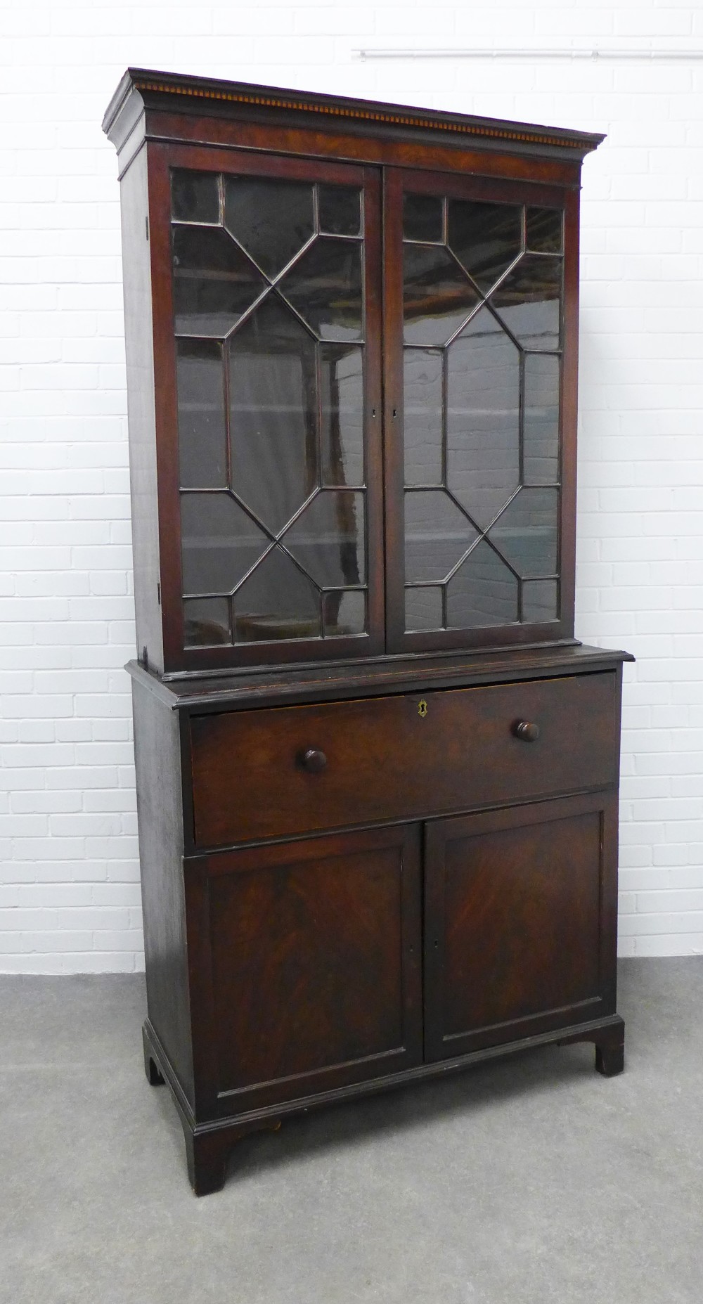 Georgian mahogany secretaire cabinet, the top with glazed doors and a shelved interior over a