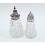 Two silver topped and cut glass sugar castors, Sheffield 1925 & Birmingham 1956, taller 17cm (2)