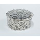 George III silver box and cover of circular form with floral repoussé work, London 1772, 13cm