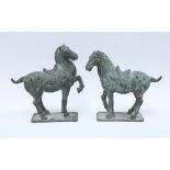 A pair of Verdigris patinated bronze Tang style horses, 20cm high (2)