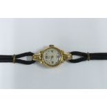 Lady's 14ct gold cased wristwatch on a black cord strap