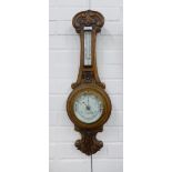 Latimer & Sons oak cased aneroid wall barometer, 67cm long