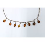 9ct gold necklace with eight citrine coloured drops, stamped 9ct