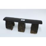 South African Zulu wooden neck rest on three linear pattern supports, 39.5cm long