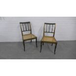 Pair of green painted and parcel gilt side chairs with cane work seats. 83 x 46 x 40cm. (2)